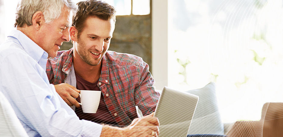 Dad and adult son using computer to see options for pull-ups and continence aids